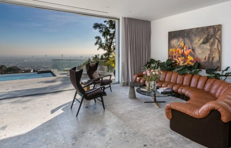 mid-century classic design with a great view to a pool and far-away city by The Best Interior Designers In California (Part VII)